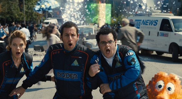 Violet (Michelle Monaghan), Sam Brenner (Adam Sandler), Ludlow (Josh Gad) and Q*bert in Columbia Pictures' PIXELS